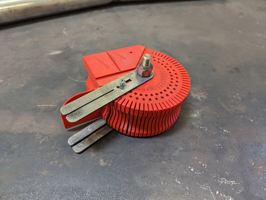 Custom tool for cutting precise angles in exhaust pipes